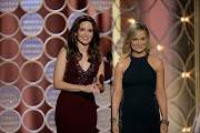 Tina Fey and Amy Poehler will co-host this year's Golden Globes in a bicoastal event. File photo.