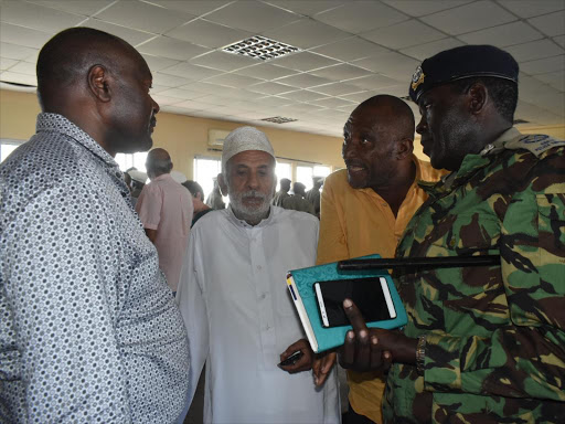 NTSA director general Francis Meja, Mombasa Police Commander Johnston Ipara and matatu owners on Monday in Mombasa / BRIAN OTIENO