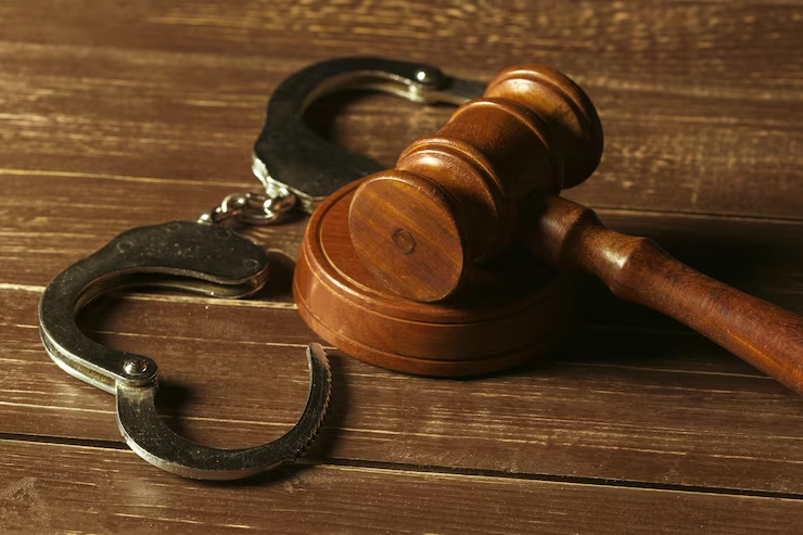 Judge's gavel on a wooden surface.