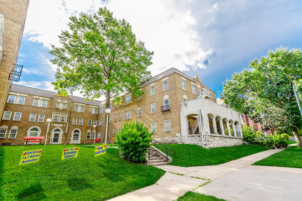 Avon red brick building featuring courtyard and column/arch stonework areas