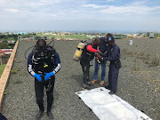 Divers on site in Verulam after human skeletal remains were found in a water reservoir.