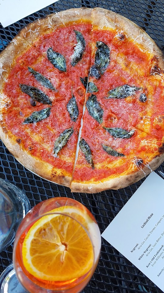 Ken's Artisan Pizza, 12 inch thin crust perfection, this one is the Pomodoro Royale with tomato sauce, basil, evoo, Pecorino Romano, enjoyed here with the Aperol Spritz (with Aperol, Sparkling Wine, orange wheel)