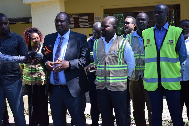 Homa Bay county commissioner Moses Lilan, KeNHA official Julius Makodero and Weighbridge officer Maurice Ademba in Homa Bay town on May 15,2023