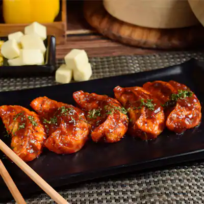 Corn Cheese Pan Fried Momo In Tomato Garlic Sauce