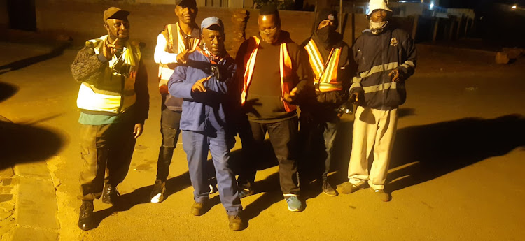 Kathorus neighbourhood watch and security group volunteers patrol their community night and day.