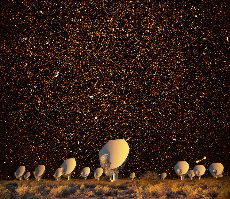 Thousands of galaxies are visible in this radio image covering a square degree of sky near the south celestial pole, made by the MeerKAT radio telescope array (foreground) in the Karoo.