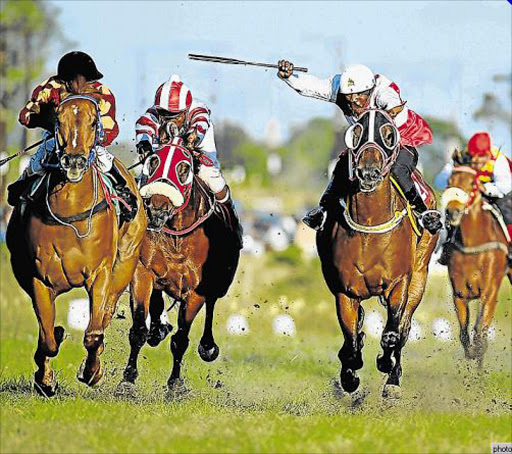 THE PACE IS ON: Riders charge down the home-straight during one of the races at last year’s Berlin November event. The next Masibambisane Horse-racing event takes place at the Berlin race track tomorrow Picture: MARK ANDREWS