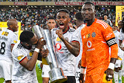 Innocent Maela, captain of Orlando Pirates and mates with the trophy during the MTN8 final match between AmaZulu FC and Orlando Pirates at Moses Mabhida Stadium.