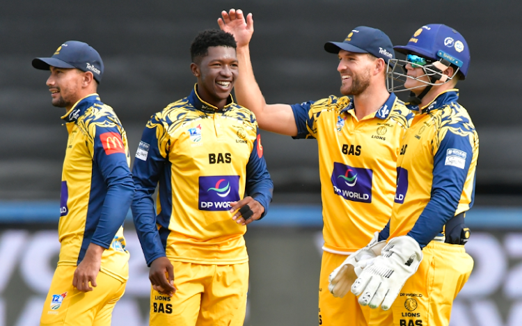 Nqaba Peter and his Lions teammates celebrate his dismissal of Caleb Seleka of the North West Dragons at the Wanderers on Sunday