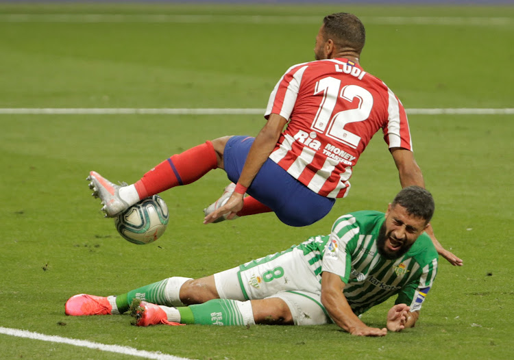 Real Betis' Nabil Fekir in action with Atletico Madrid's Renan Lodi,