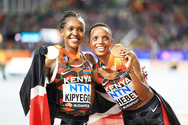 Faith Kipyegon and Beatrice Chebet celebrate after the 5000m final