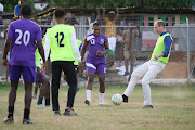 Prince William shows off his football skills during a visit to Trench Town.