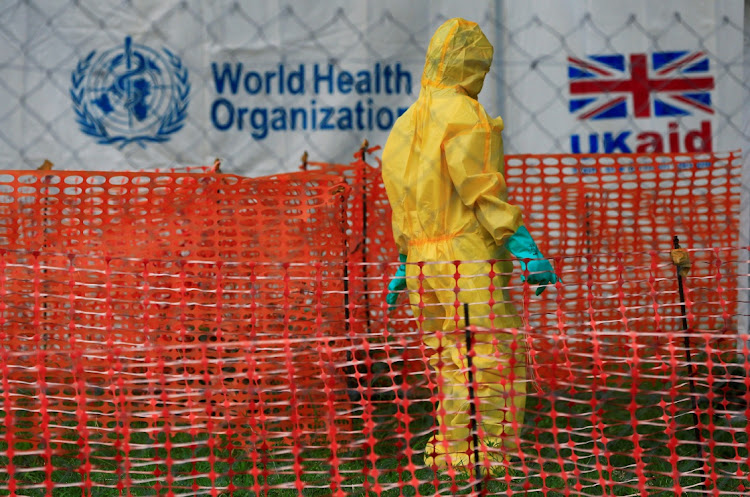 A person dressed in Ebola protective apparel walks inside an Ebola care facility in Bwera, Uganda, during a previous outbreak in 2019. Picture: JAMES AKENA/REUTERS