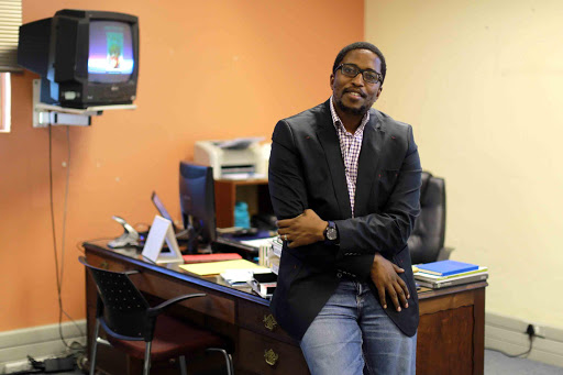 RISING STAR: Bongani Siqoko has been appointed editor of the Sunday Times. Siqoko, who is currently editor of the Daily Dispatch, is pictured at his desk Picture: ALAN EASON