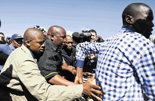 Police forced expelled ANC Youth League leader Julius Malema to leave Marikana yesterday without addressing about 5 000 striking mineworkers who had gathered to hear him speak following his visit to the area.