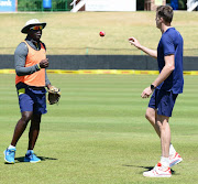 South Africa senior men's cricket team head coach Ottis Gibson tosses the ball to fast bowler Morne Morkel during the Proteas's training session and press conference at Senwes Park on September 27, 2017 in Potchefstroom, South Africa.