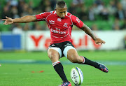 Elton Jantjies of the Lions kicks during the round six Super Rugby match between the Rebels and the Lions at AAMI Park on March 20, 2015 in Melbourne, Australia.