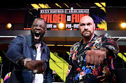 Deontay Wilder (left) and Tyson Fury face off during a news conference in Los Angeles, California, last month. Tomorrow the two will battle it out in the ring.