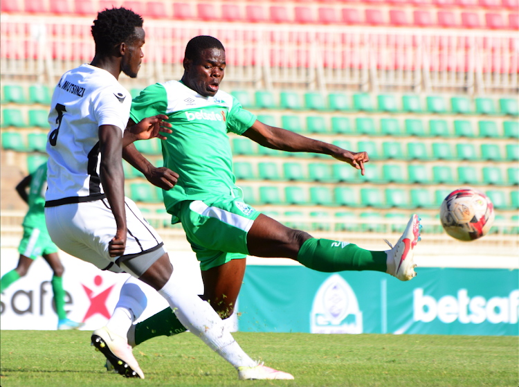 Gor Mahia's Benson Omalla (R) vies for the ball with Mutsinzi Ange of APR during their CAF Champions League preliminary round return leg match at Nyayo Stadium