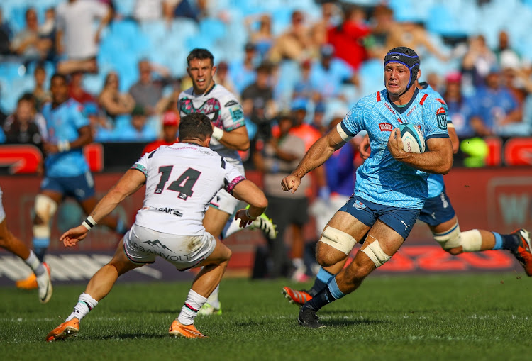 Luke Morgan of the Ospreys looking to tackle a charging Reinhardt Ludwig of the Vodacom Blue Bulls during the United Rugby Championship match at Loftus Versfeld.