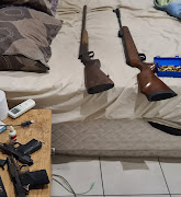 One suspect was found in possession of two unlicensed firearms and various calibre of ammunition, and nine snakes of which three did not have a permit.