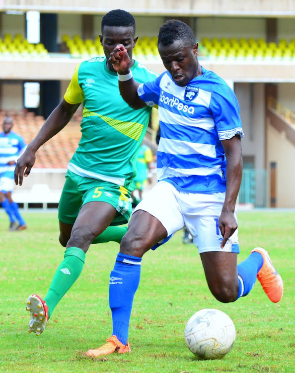 AFC Leopards' Paul Were (R) challenges Erick Juma of Kariobangi Sharks during their KPL match at Moi, Kasarani yesterday