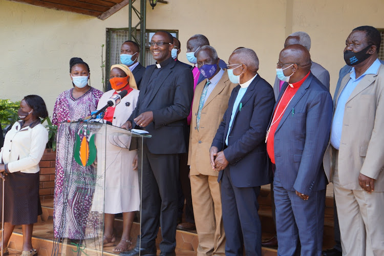 NCCK secretary general cannon Chriis Kinyajui accompanied by national executive council members speak to journalists at Kabuku in Limuru on Thursday. January 7,