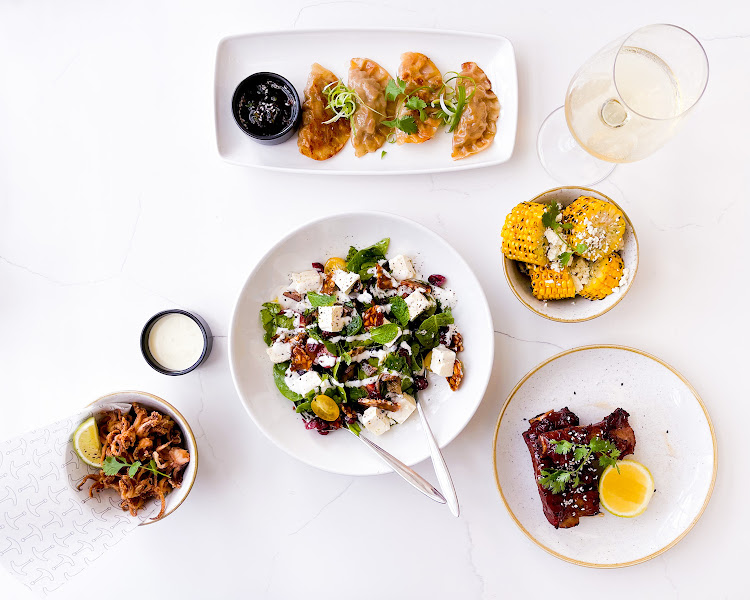 Chicken dumplings, squid heads, beef riblets, grilled corn and feta and a brinjal and feta salad.