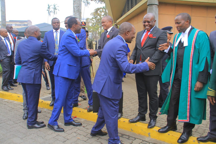 Treasury CS Njuguna Ndung'u greeting leaders ahead of Budget Reading on June 15.