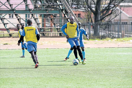 FULL STEAM AHEAD: Mthatha Bucks’ Mashale Rantabane , right, during a training session in Mthatha. The rock solid defender will be expected to marshal the Bucks defence as always when they welcome AmaZulu today Picture: ZINGISA MVUMVU