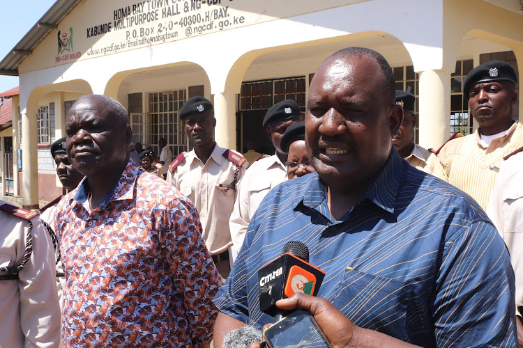 Homa Bay Deputy Governor Oyugi Magwanga and county commissioner Moses Lilan speak to journalists at Kabunde on January 7,2023