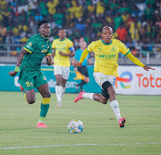 Kennedy Musonda of Young Africans and Khuliso Mudau of Mamelodi Sundowns in action during their CAF Champions League quarterfinal at the Benjamin Mkapa National Stadium.