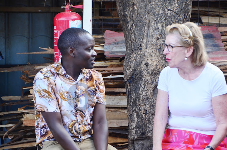 Rotary Club of Nakuru president James Yegon and Maris Mophof, a Rotarian from the Netherlands.