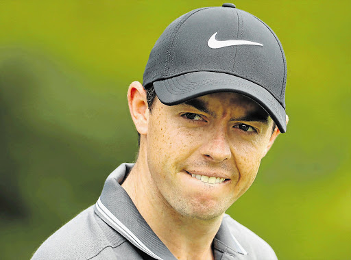 HOT FAVOURITE: Rory McIlroy of Northern Ireland watches his ball during a warm up on the driving range for the South African Open which starts at the Glendower Golf Club in Johannesburg today Picture: