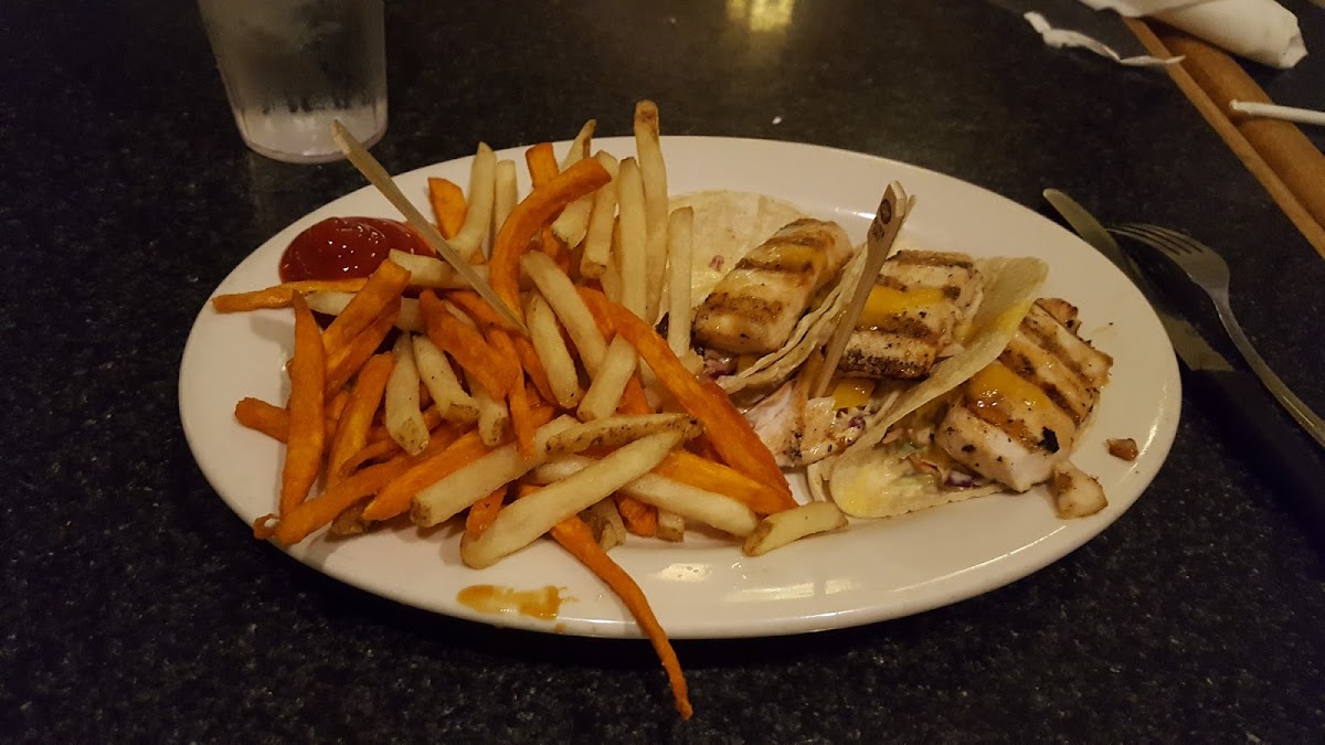 Mahimahi tacos with a mix of sweet potatoe and regular fries from a DEDICATED FRYER. Yum!