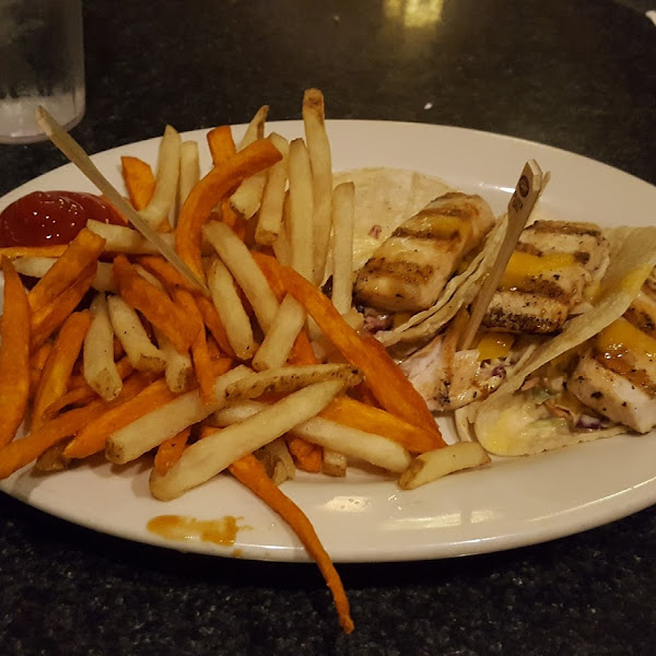 Mahimahi tacos with a mix of sweet potatoe and regular fries from a DEDICATED FRYER. Yum!