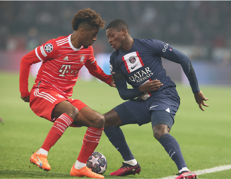 Bayern Munich's Kingsley Coman (L) vies for the ball with Paris Saint-Germain's Nuno Mendes