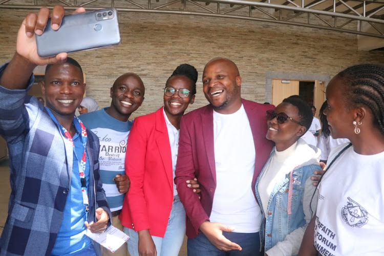 Lang’ata MP Phelix Odiwuor popularly known as Jalang’o with youth at the premier of the movie, The Letter, at Catholic University of East Africa on 15/10/2022