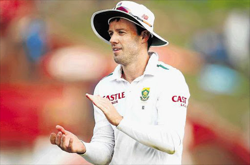 ROUND OF APPLAUSE: AB de Villiers lauds his star bowler Kagiso Rabada after he had set a record number of wickets taken against England in the fourth Test at SuperSport Park in CenturionPicture: GETTY IMAGES