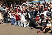 Supporters of the Movement for Democratic Change opposition party of Nelson Chamisa demonstrate outside the party's headquarters as they await results of general elections in Harare, Zimbabwe, August 1, 2018. 