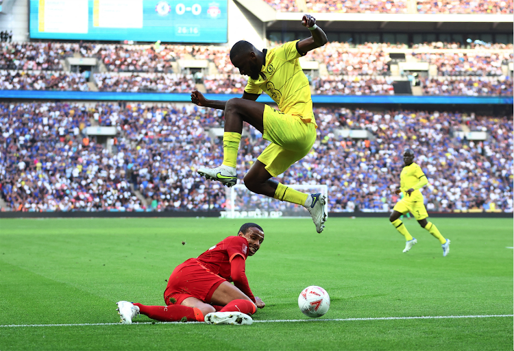 Chelsea's Antonio Rudiger in action with Liverpool's Joel Matip