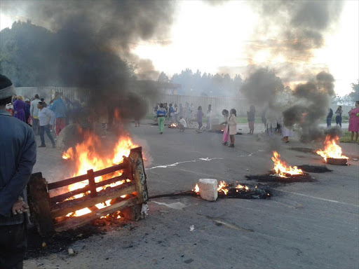 Protesting community members have blocked a road leading into Reiger Park in Boksburg with burning tyres and rubble.
