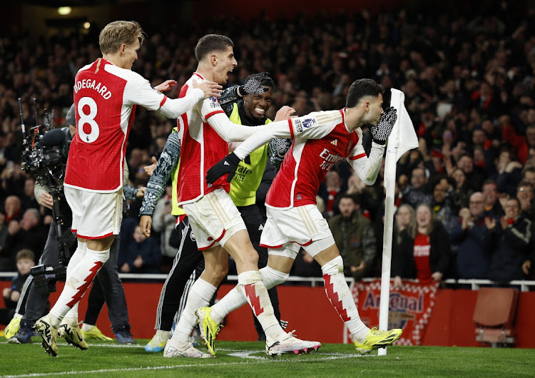 Gabriel Martinelli celebrates scoring Arsenal's second goal with Kai Havertz and Martin Odegaard in their Premier League match against Liverpool at Emirates Stadium in London on Sunday.