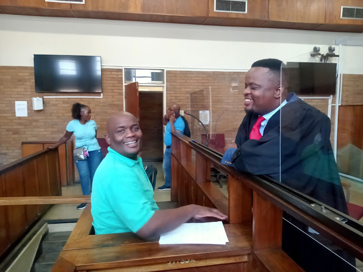 Mpumalanga chief whip, talking to murder accused Philemon Lukhele after court proceedings in the Nelspruit magistrates court on Thursday.