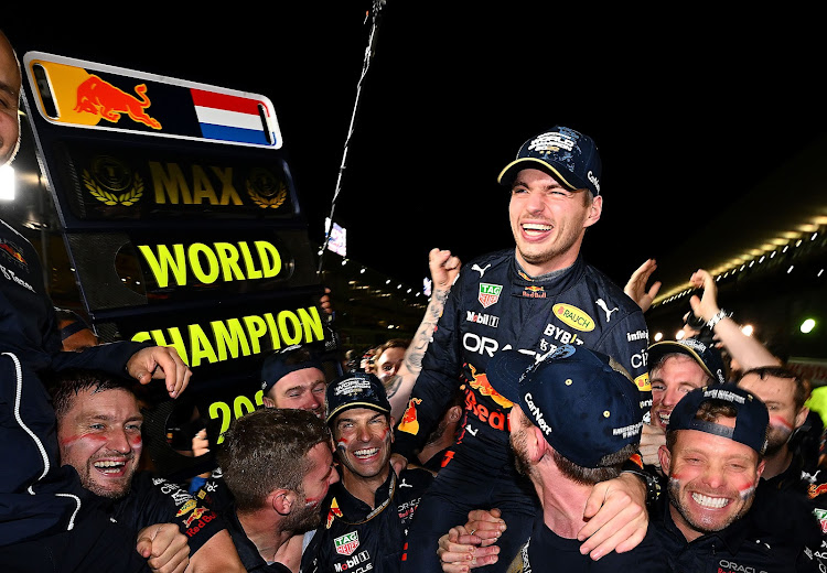 Max Verstappen of the Netherlands and Oracle Red Bull Racing celebrates with his team after winning the F1 Grand Prix of Japan and the world championship at Suzuka International Racing Course on October 9, 2022 in Suzuka