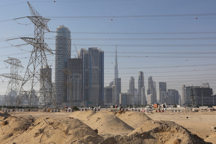 A construction site is seen, with the Dubai skyline including the Burj Khalifa tower visible in the background, in Dubai, United Arab Emirates, on January 24 2024. Picture: AMR ALFIKY/REUTERS