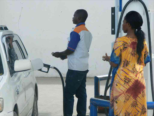 A car is fueled at a petrol station in Mandera town. /FILE