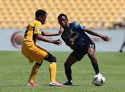 Thando Buthelezi of Mamelodi Sundowns challenged by Puso Dithejane of Kaizer Chiefs during the DStv Diski Challenge 2021/22 match between Kaizer Chiefs and Mamelodi Sundowns on the weekend.