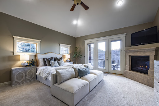 Master bedroom with fireplace and balcony - Buy this luxury house in Draper, 9 bedrooms