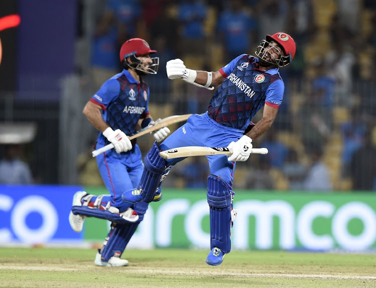 Rahmat Shah and Hashmatullah Shahidi celebrate after Afghanistan beat Pakistan. Picture: REUTERS/SAMUEL RAJKUMAR